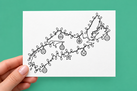 Black-and-white colouring Christmas card showing an outline map of Nova Scotia, including Cape Breton Island, wrapped in a string of Christmas lights with patterned ornaments and a star hanging along the coast.